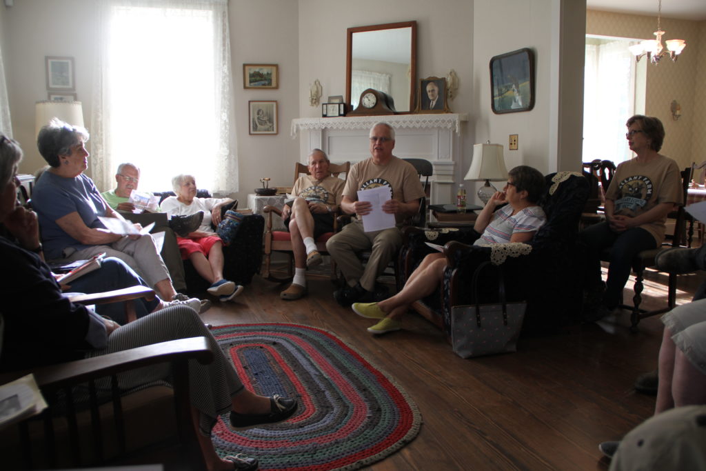 group talking in living room of farmhouse