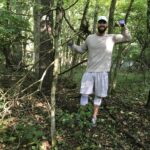 Volunteer removing invasive bush honeysuckle from Shale Hollow Park