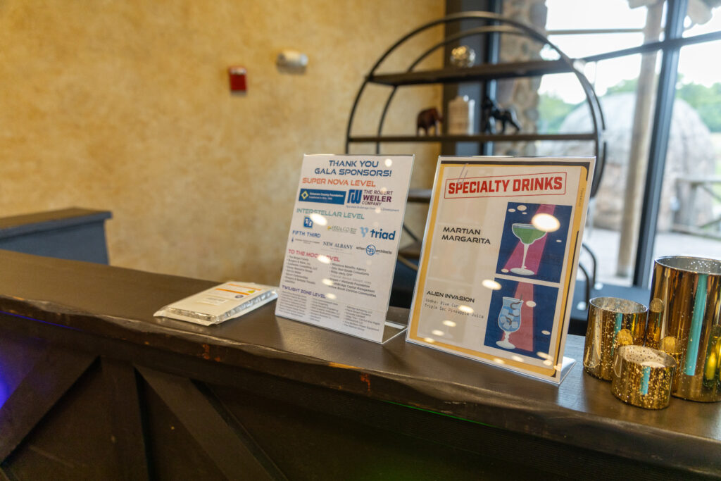 drink menu and sponsor list at bar