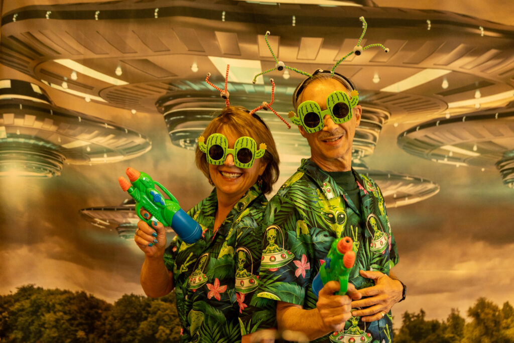 guests in area 51 themed photo booth