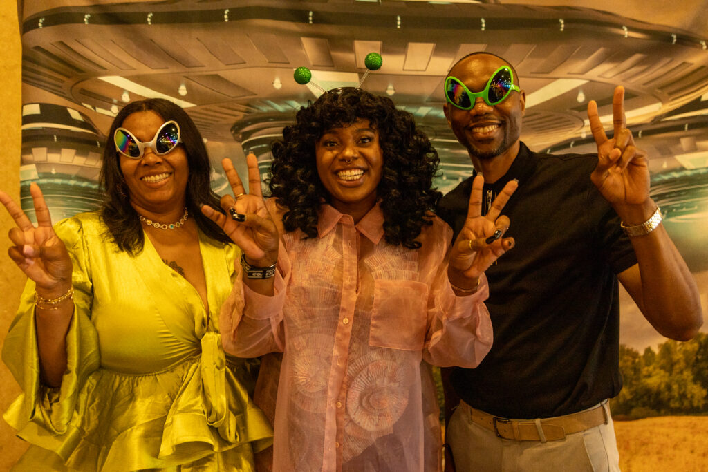 guests in area 51 themed photo booth