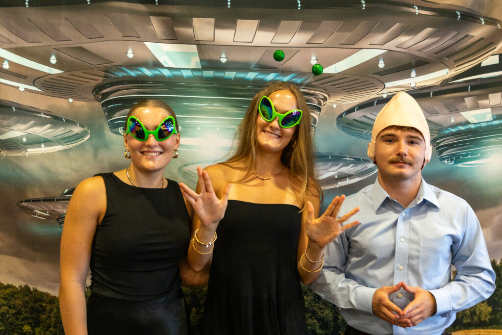 guests in area 51 themed photo booth
