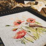 Cross stitching of pink flowers