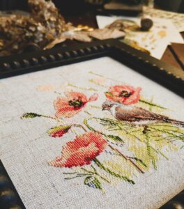 Cross stitching of pink flowers