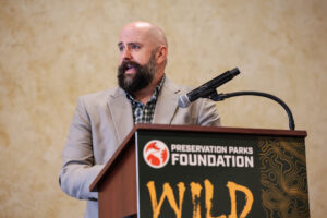 Author Jarod Anderson speaking at podium