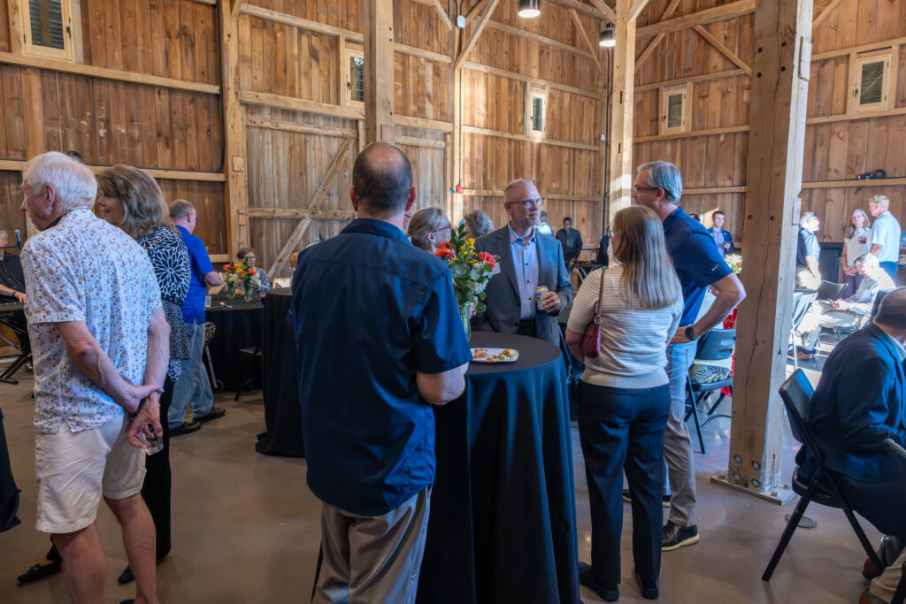 people mingling at cocktail table in event hall
